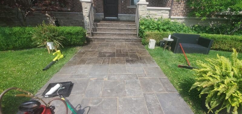 Before and after view of power washed driveway.