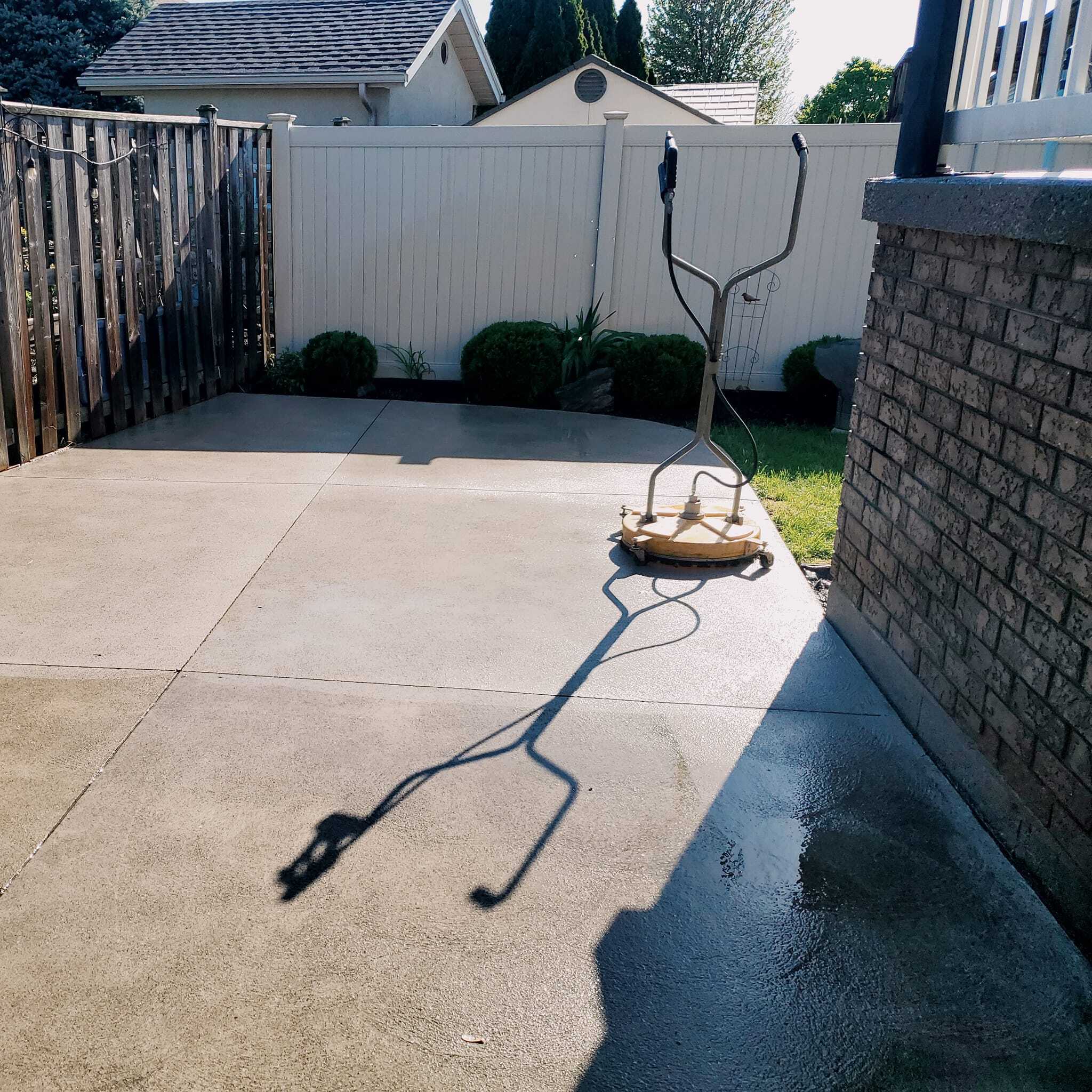 Bloodhound ops power washing of residential concrete pad.